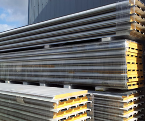 Sandwich panels in front of warehouse
